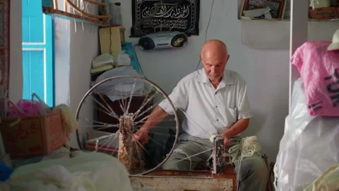 Old manufacturer making thread in old style in Sousse. Stock Footage 296384980