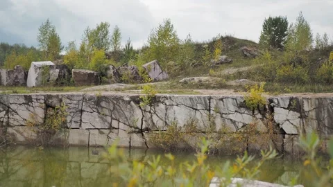 An old marble quarry filled with water. Hand held. Siberia. Stock Footage 322118705