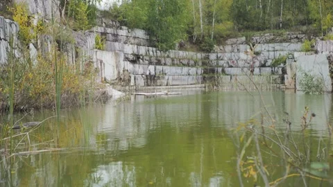 An old marble quarry filled with water. Hand held. Siberia. Stock Footage 322118734
