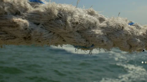 Old marine rope close-up on the background of the sea and sea waves. 4k video Stock Footage 109691841