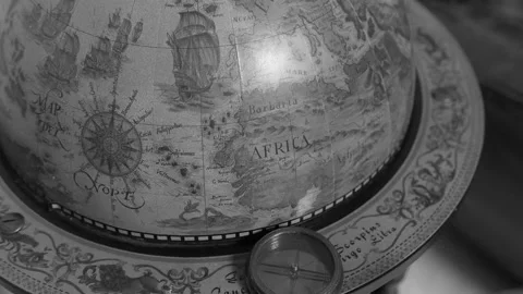 Old mariner’s Compass On Globe in Black and White Video stock 164653381