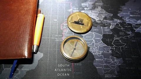 Old Mariner's compass on modern map Video stock 164117507