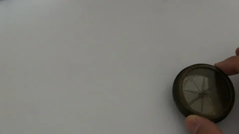 Old mariner's compass on white desk Video stock 164118489