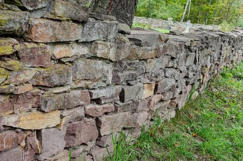 Old masonry of travertine at an angle to the observer Stock Photos