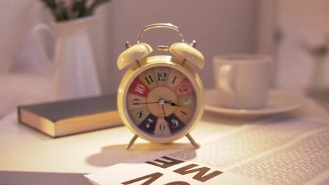 An old mechanical alarm clock rings in the room in the early morning. Stock Footage 245615739