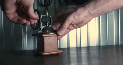 Old mechanical coffee grinder stands in the kitchen Stock Footage 168717338