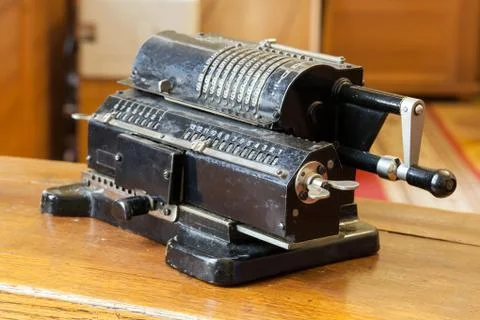 Old mechanical manual counting machine for mathematical calculations Stock Photos