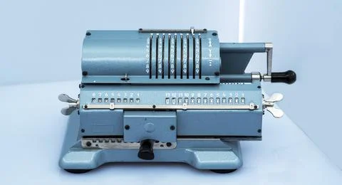 Old mechanical manual counting machine for mathematical calculations Stock Photos