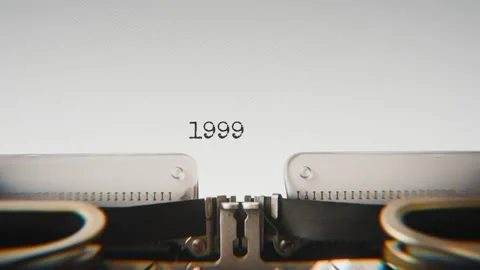 Old mechanical typewriter typing Year 1999 in a close-up view, with metal Stock Footage 321452444