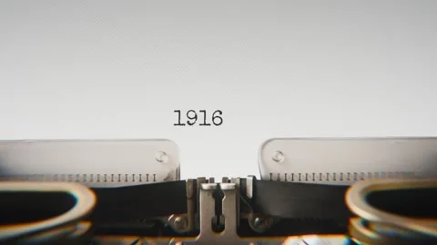 Old mechanical typewriter typing Year 1916 in a close-up view, with metal Stock Footage 321452472