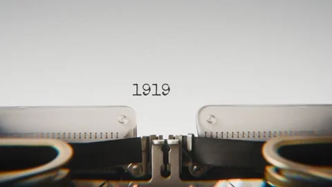 Old mechanical typewriter typing Year 19Year 19 in a close-up view, with metal Stock Footage 321452479