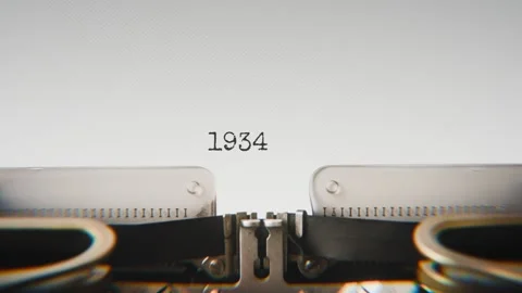 Old mechanical typewriter typing Year 1934 in a close-up view, with metal Stock Footage 321452579