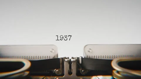 Old mechanical typewriter typing Year 1937 in a close-up view, with metal Stock Footage 321452590
