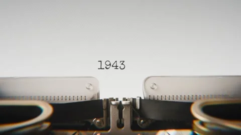 Old mechanical typewriter typing Year 1943 in a close-up view, with metal Stock Footage 321452613