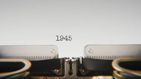 Old mechanical typewriter typing Year 1945 in a close-up view, with metal Stock Footage 321452619