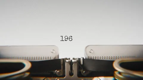Old mechanical typewriter typing Year 1969 in a close-up view, with metal Stock Footage 321452786
