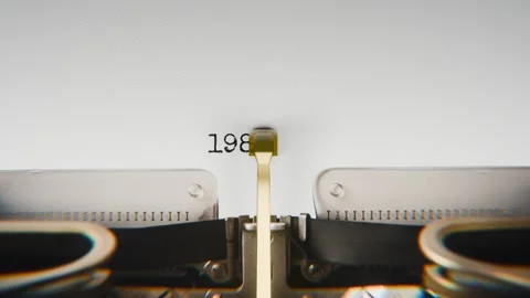 Old mechanical typewriter typing Year 1981 in a close-up view, with metal Stock Footage 321452870