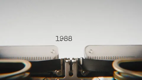 Old mechanical typewriter typing Year 1988 in a close-up view, with metal Stock Footage 321452919