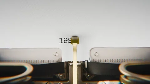 Old mechanical typewriter typing Year 1992 in a close-up view, with metal Stock Footage 321452948