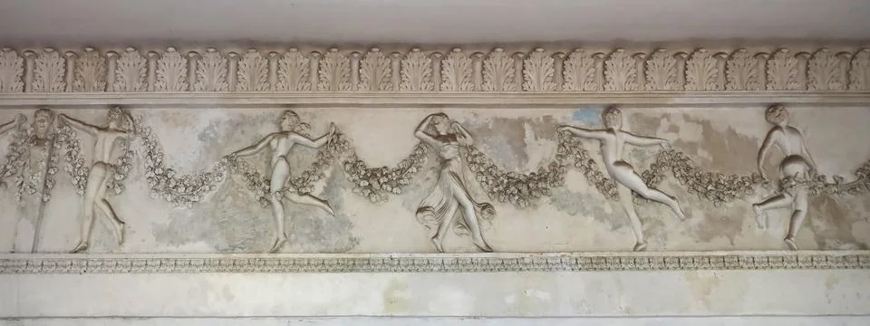Old medieval elements of architectural decorations of buildings, moldings and Stock Photos