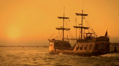 Old medieval ship gracefully sailing to open sea, travelling towards adventures Stock Footage 75910797