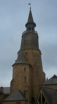 Old medieval stone clock tower in Dinan, France Stock Photos