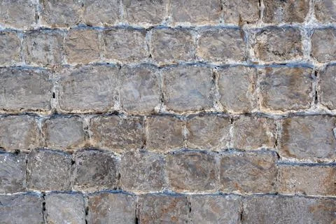 Old medieval stone wall for use background texture Stock Photos