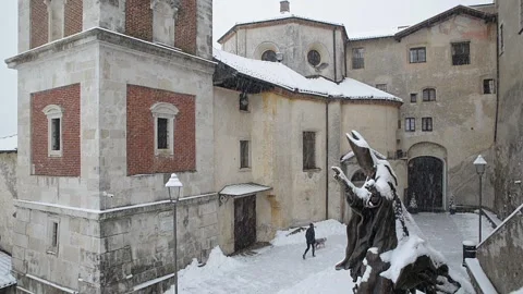 Old medieval village during a snowfall. Sacro Monte Varese, Italy. Unesco site Stock Footage 262437720