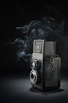 Old medium format camera on black Stock Photos