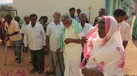 Old men with crutches in India Stock Footage 49323087