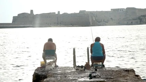 Old men fishing Stock Footage 77465533