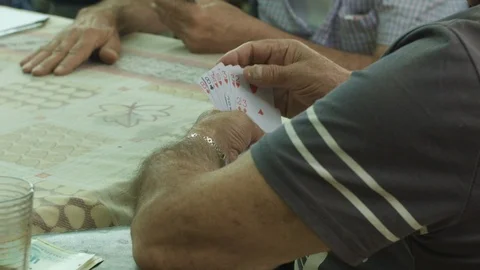 Old men playing cards Stock Footage