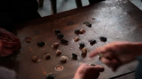 Old men plays table  game Stock Footage 49057590