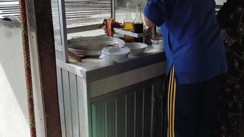 Old men preparing chicken noodle Stock Footage 231761454