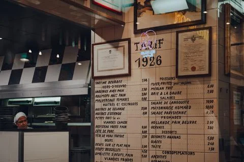 Old menu on a wall inside Chez Leon family-owned restaurant in Brussels, Belg Stock Photos