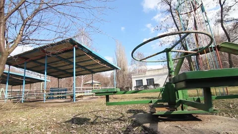 Old Merry-Go-Round Spinning In Eastern European Orphanage Playground Stock-Footage 102154233