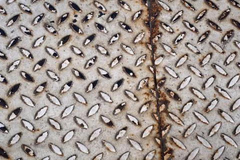 Old metal background texture with rust and raised diamond texture bumps Stock Photos