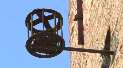An old metal basket placed on the wall of a tower Stock Footage 59657433