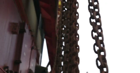 Old metal chains waved in wind hang on container closeup Stock-Footage 320454273
