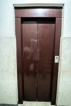 Old metal elevator door inside an old building Stock Photos