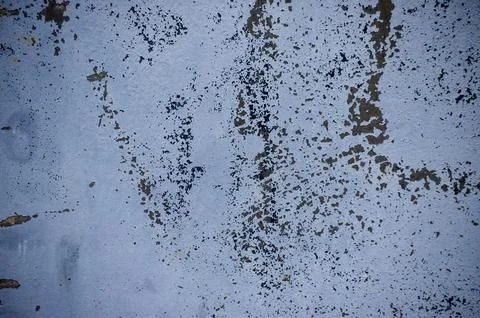 Old metal gray surface with rusty specks. Stock Photos