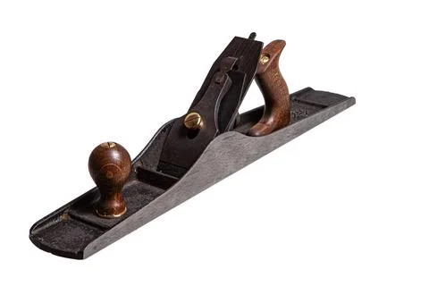 Old Metal Jointer Plane Ancient cast iron plane on an isolated background ... Stock Photos