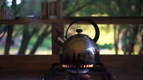 Old Metal Kettle is Warming up by a Fire Against background of a Glamping Tent 스톡 동영상 255459475
