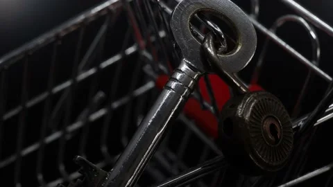 Old metal key and lock in shopping cart Stock Footage 171569236