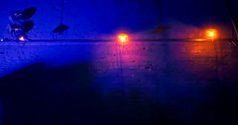 Old metal lanterns swing in different directions in blue neon light in nightclub Stock Footage 220881186