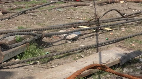 Old metal rusty ropes are tangled on river bank Stock Footage 63074528