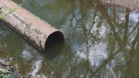 Old metal sewer pipe through which waste is discharged. Stock Footage 273608193