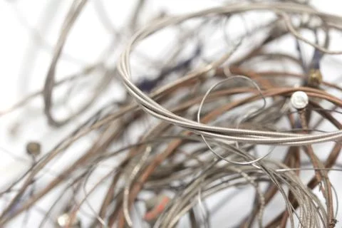 Old metal strings on a white background Foto stock