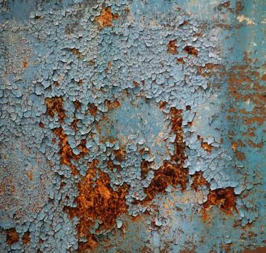 Old metal surface with rust and brown-blue paint Stock Photos