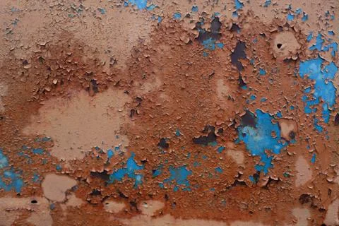 Old metal surface with rust and brown-blue paint Stock Photos